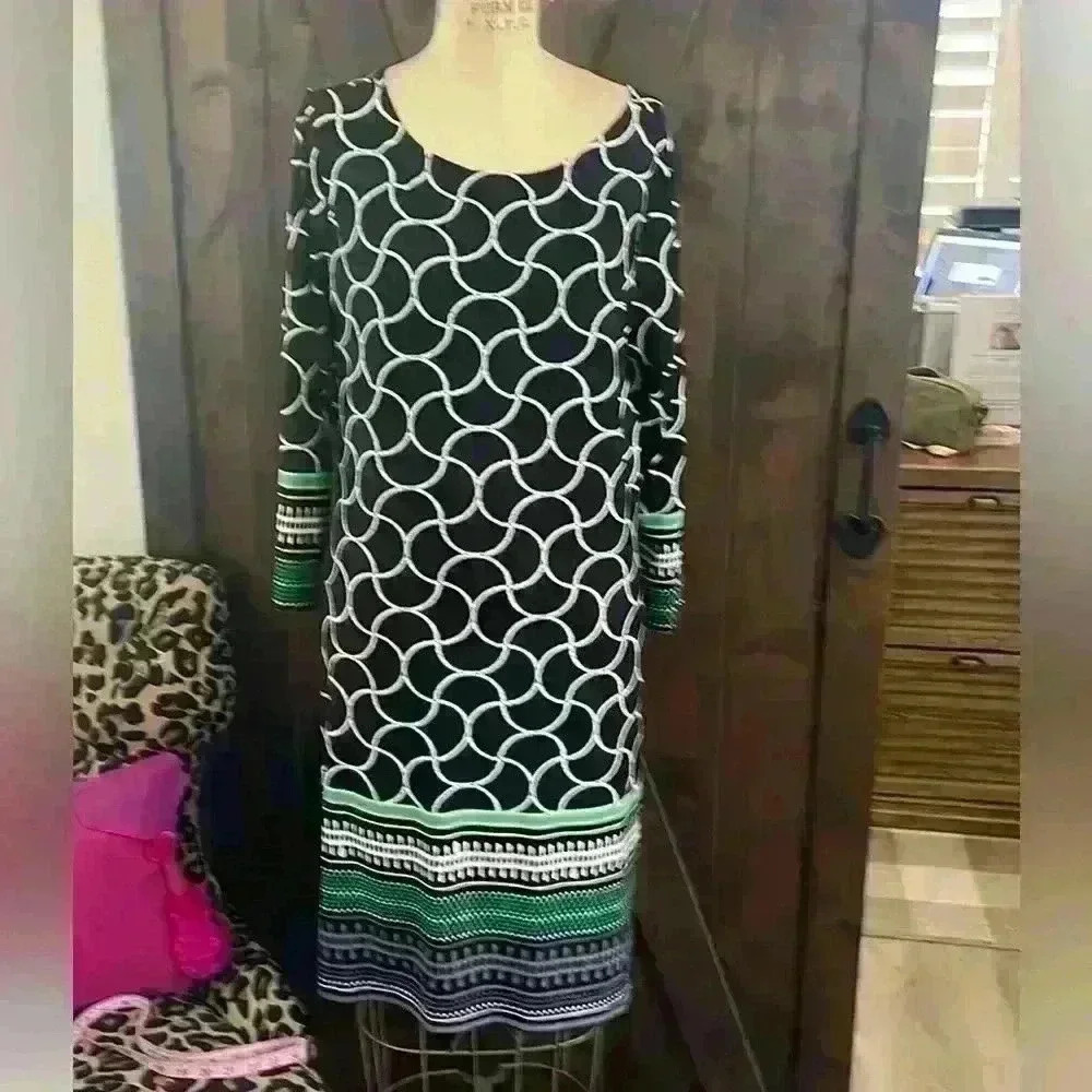 Hannibal 3/4 sleeve Navy dress with cute printed borders on sleeves and hem.